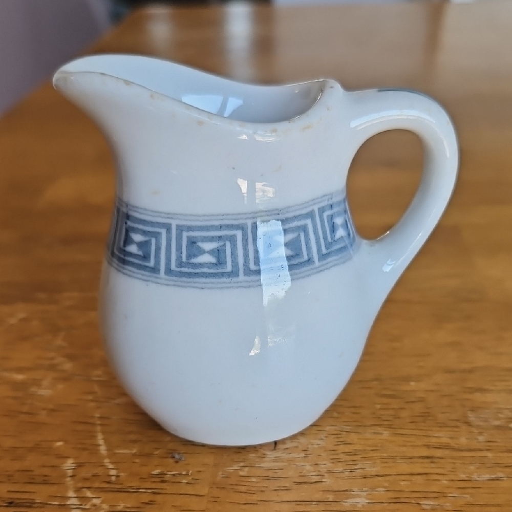 Elegant White and Blue Ceramic Pitcher